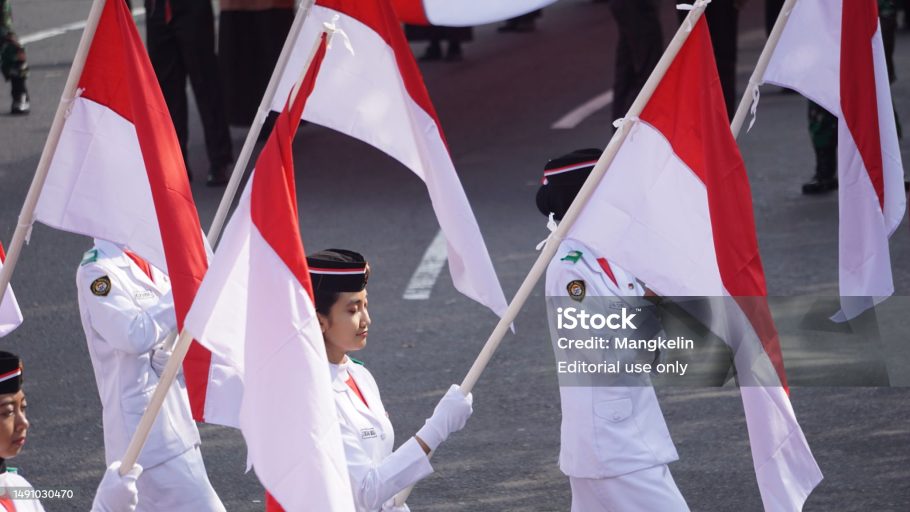Kediri, East Java, Indonesia - May 12th, 2023 : Indonesian flag raiser on kirab kebangsaan (National carnival)